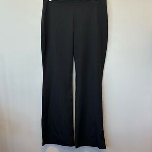 Woman’s black dress slacks. Flair legs sipper in back of pants. Size 2XL.